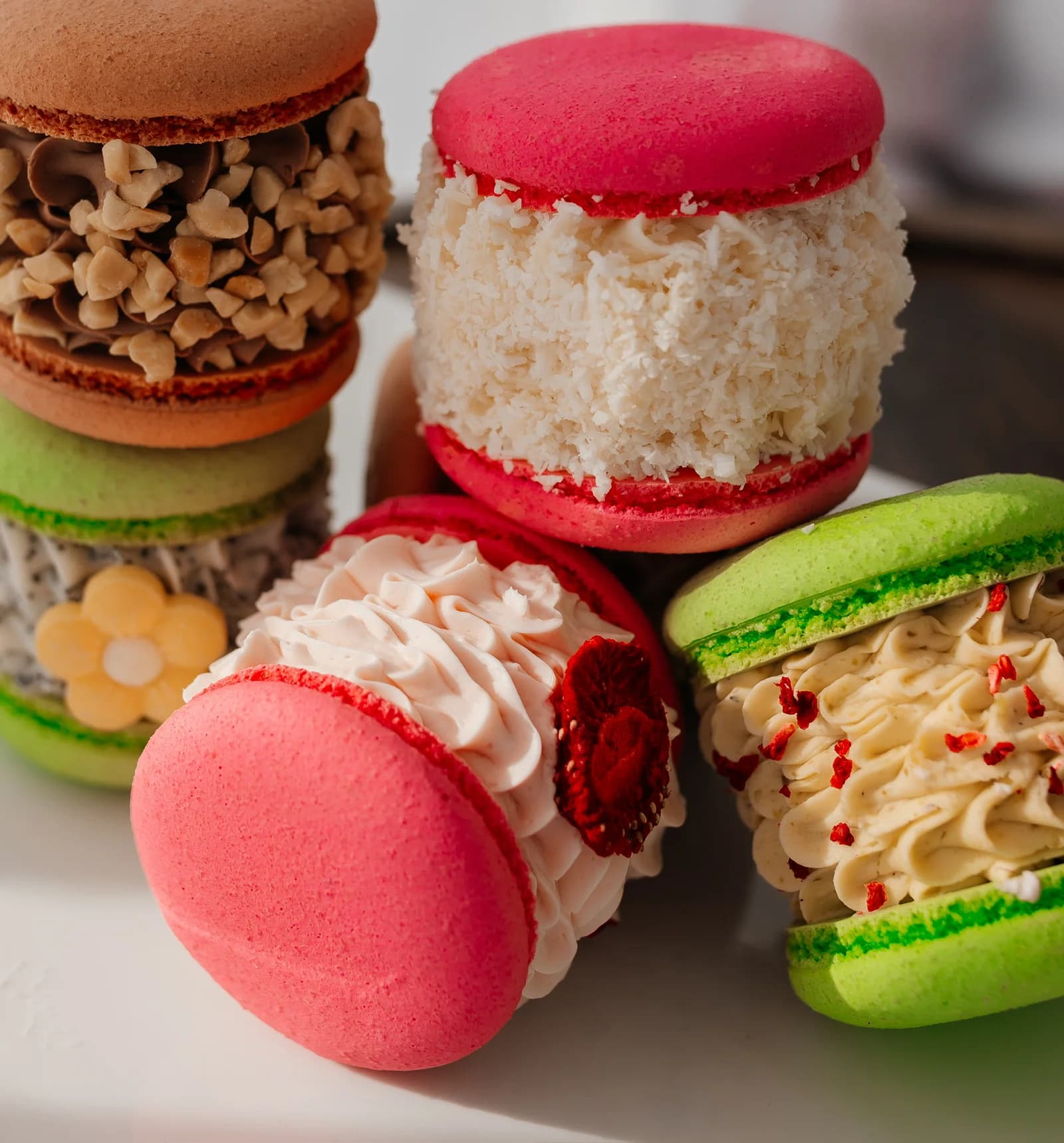A close stack of macarons in soft light